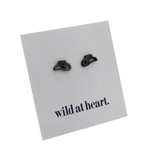 Black cowgirl hat earrings on a black card with 'wild at heart.' text