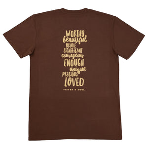 A brown short-sleeve t-shirt shown from the back, featuring a vertical stack of inspirational words in a light tan handwritten-style font, including 'WORTHY', 'BEAUTIFUL', 'BRAVE', 'SIGNIFICANT', 'COURAGEOUS', 'ENOUGH', 'UNIQUE', 'PRECIOUS', and 'LOVED', with 'SISTER & SOUL' printed below.