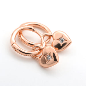 Rose gold heart-shaped keychain with diamond accents on a white background