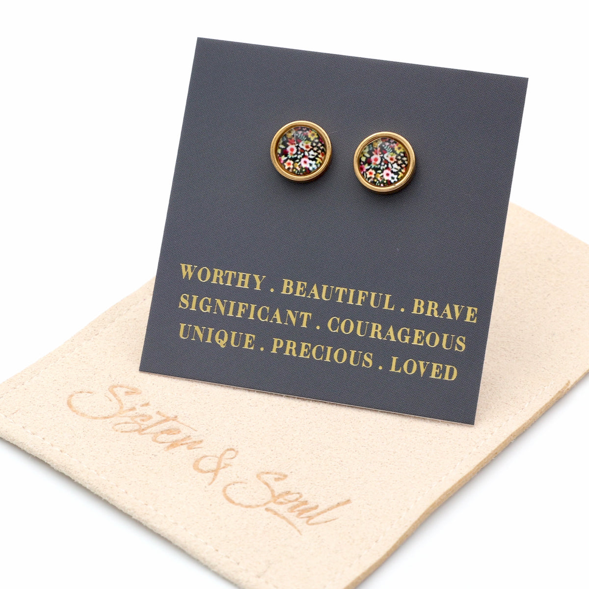 Pair of floral earrings on a card with motivational phrases and 'Sister & Soul' branding.