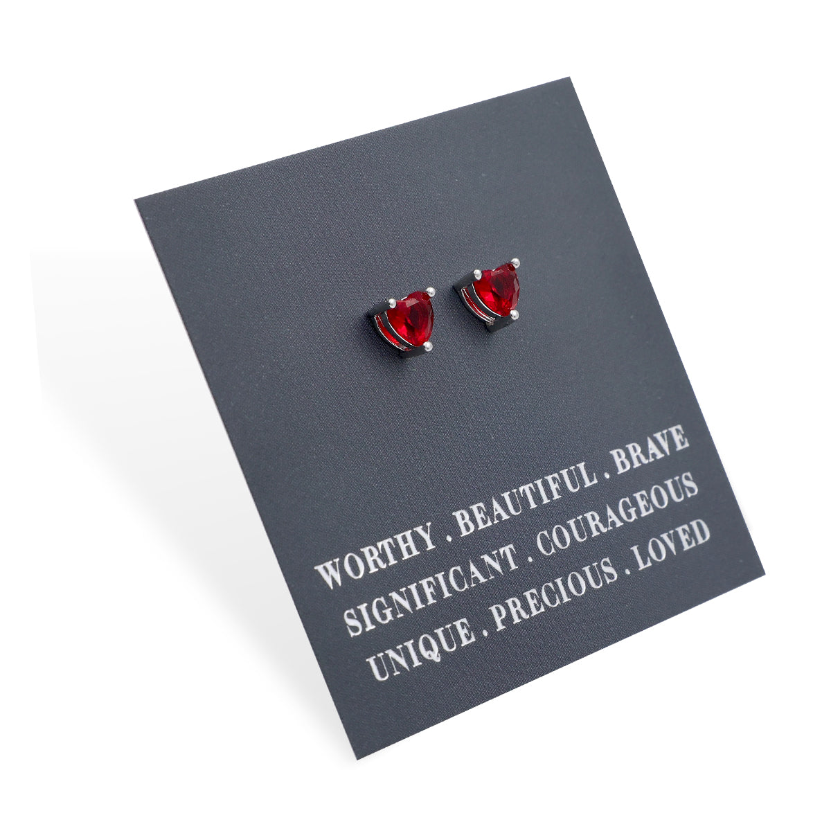 Red heart-shaped earrings on a gray card with motivational text
