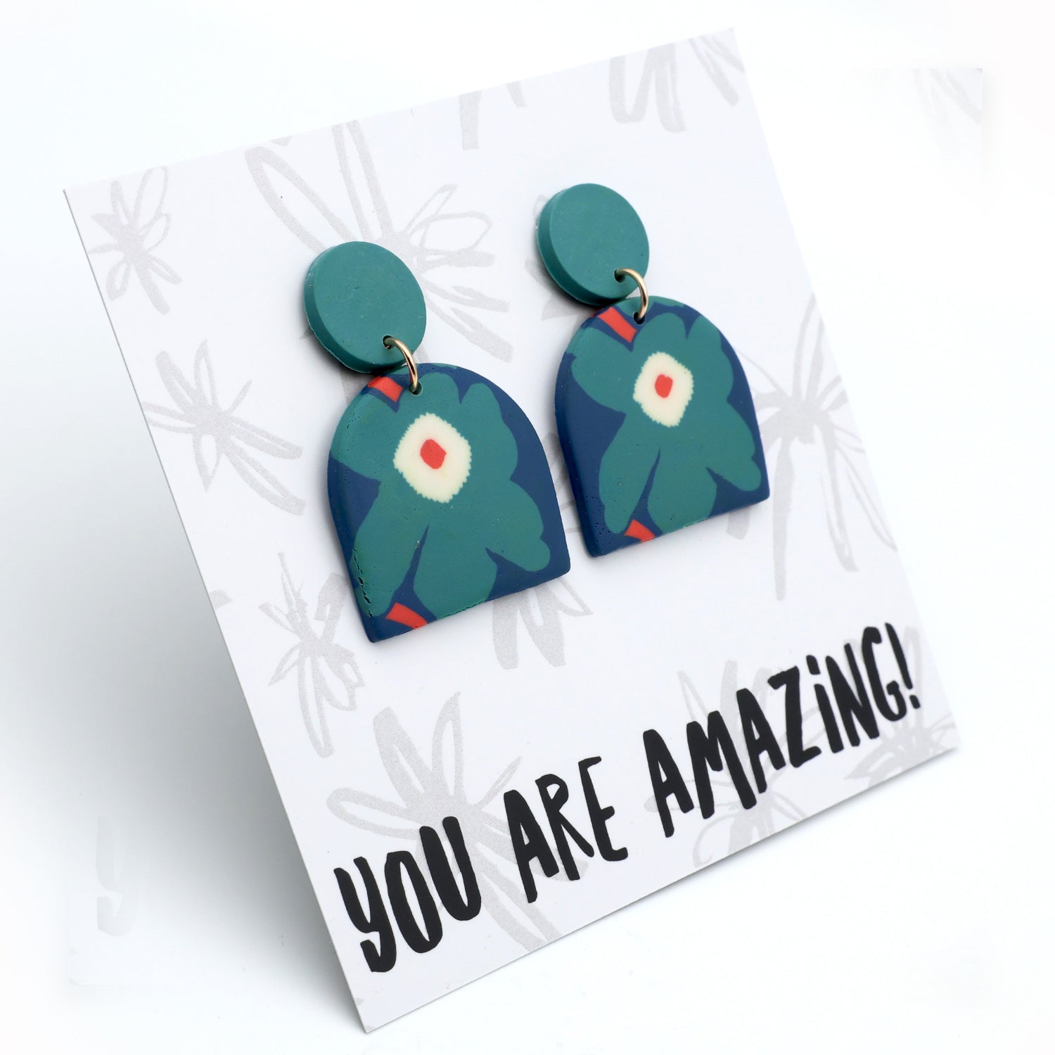 Pair of green floral earrings on a card with 'YOU ARE AMAZING!' text
