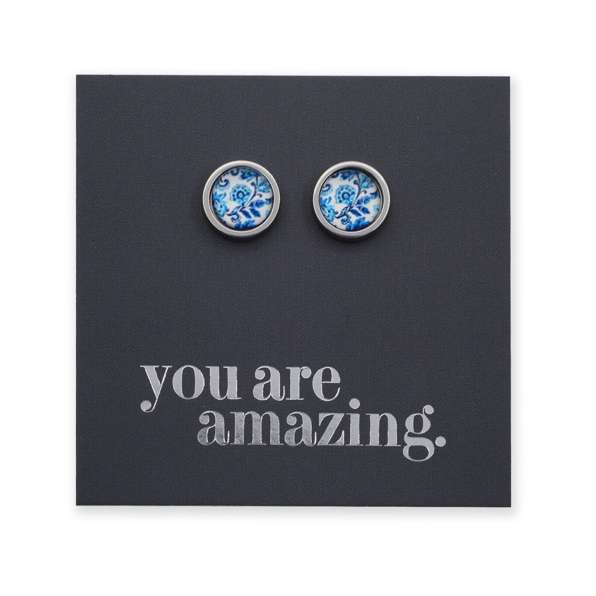 Pair of silver earrings with blue floral design on a black card with 'you are amazing' text.