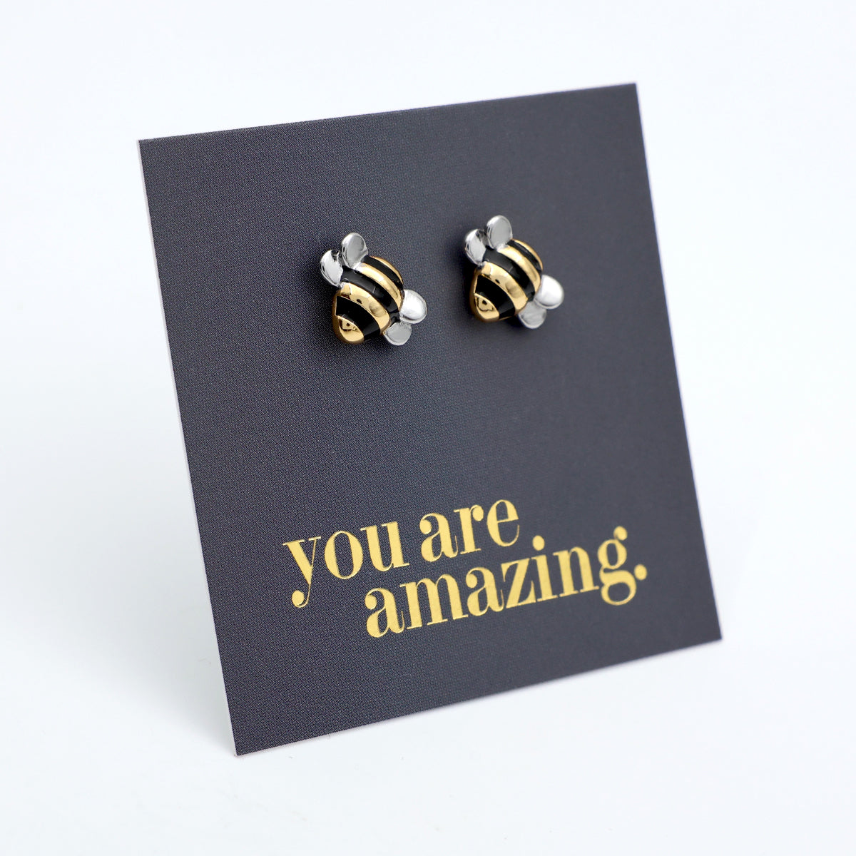 Bee-shaped earrings on a card with 'you are amazing' text