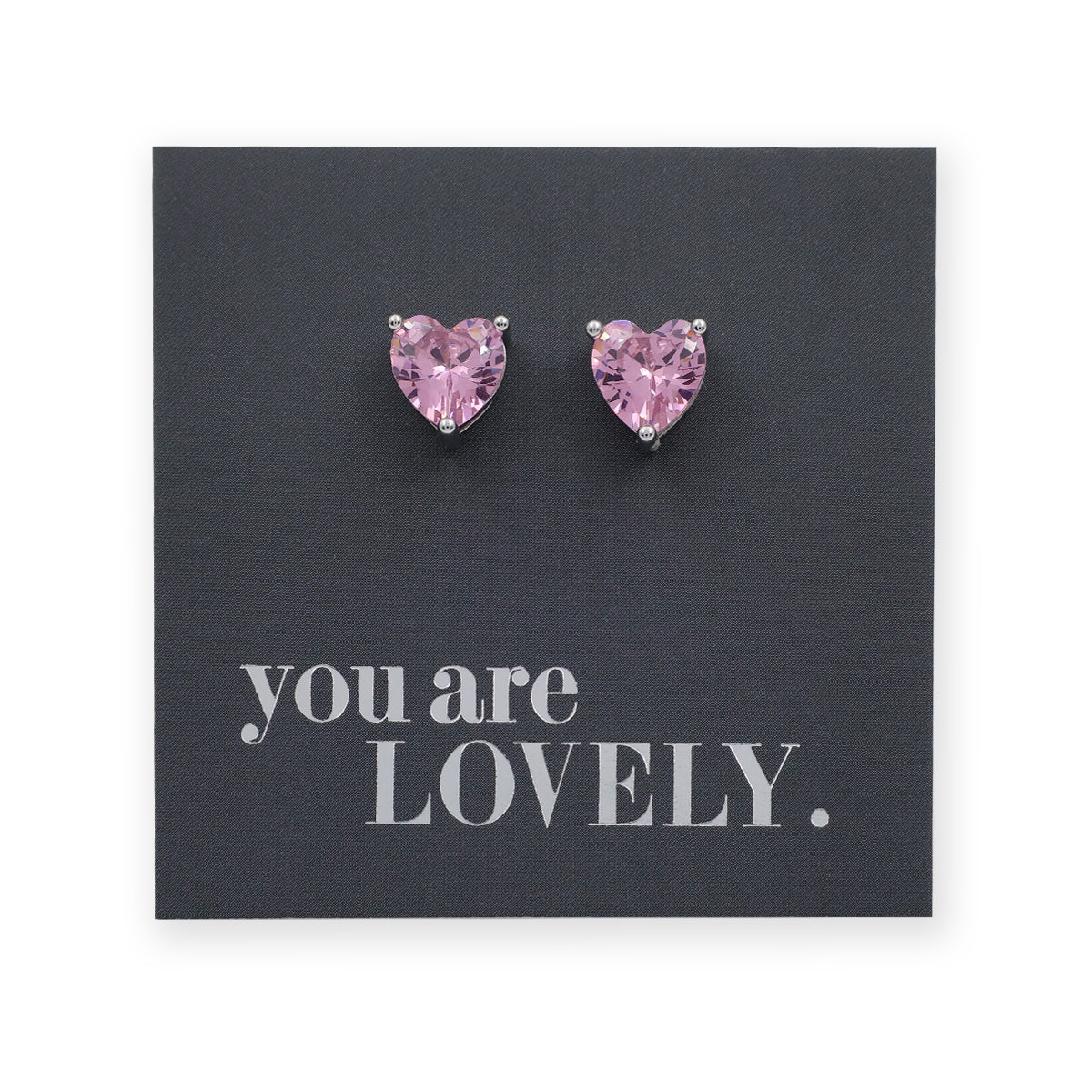 Heart-shaped pink earrings on a card with 'you are LOVELY.' text
