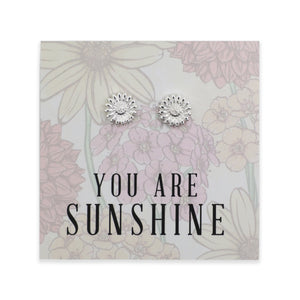 Silver floral earrings on a card with 'You are Sunshine' text and floral design