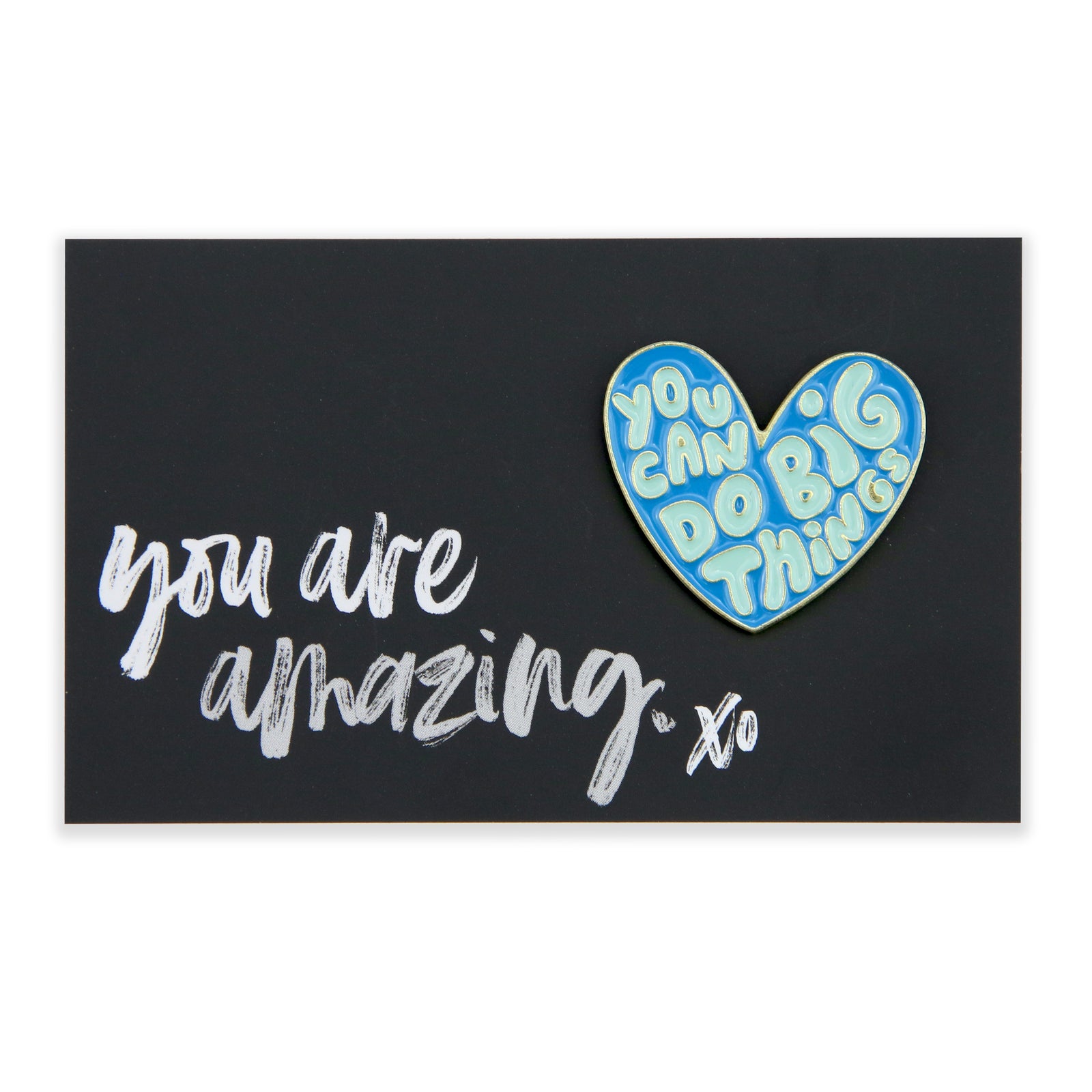 An enamel badge pin with a blue heart shape and the phrase 'You can do big things' on a black background, accompanied by the words 'you are amazing' in a cursive script.