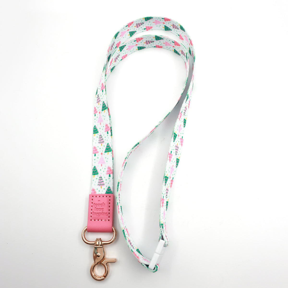 Full-length Christmas Delight lanyard with colourful Christmas trees, a pink Teach Love Inspire tab and gold-tone clasp.