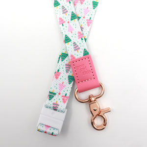 Christmas Delight lanyard with colourful Christmas trees, a pink You Got This tab, gold-tone clasp and white breakaway fastening.