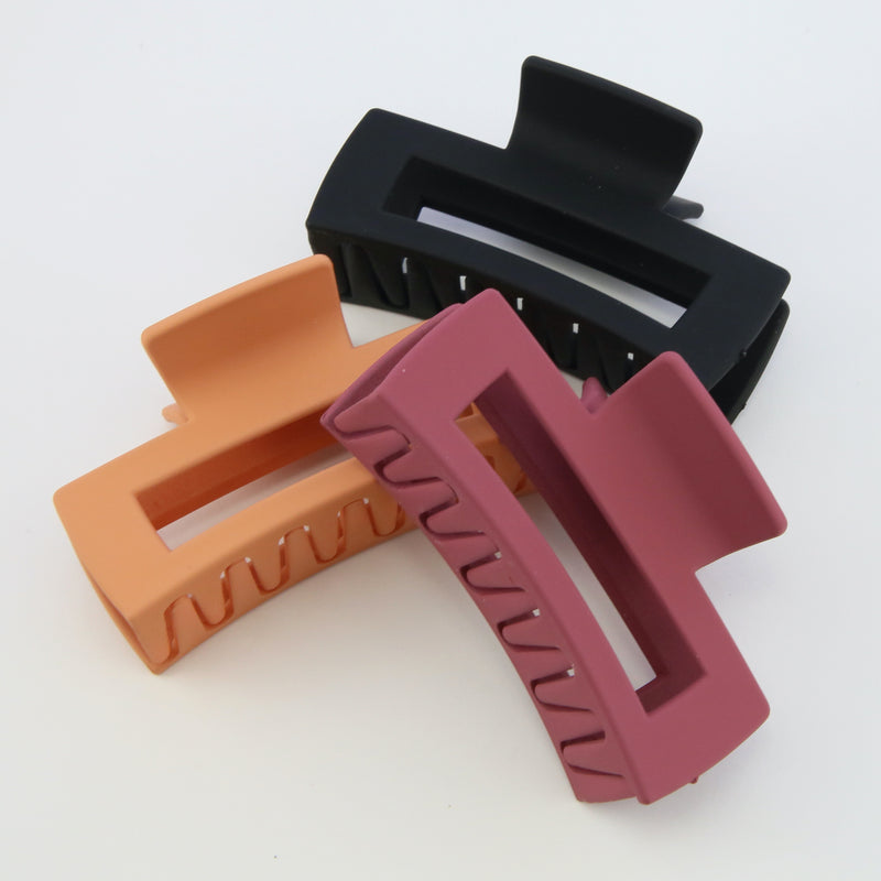 Hair accessories. 3 pack of hair claw clips in matte black, orange and raspberry. 