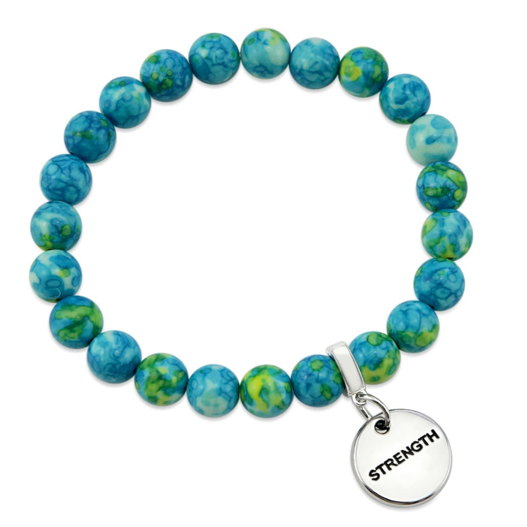 Stone bracelets with blue and green stone beads and silver charms with the words 'strength', 'loved', and 'inspire' on them.