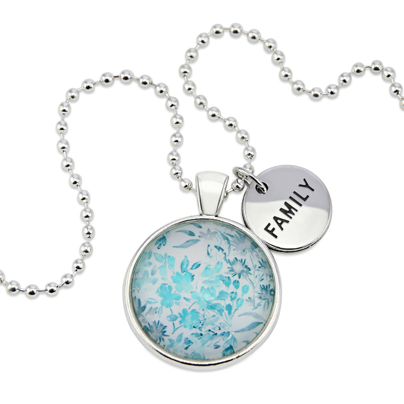 Teal print floral pendant necklace in bright silver with family charm. 