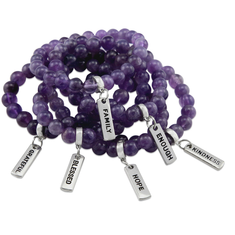 Purple amethyst stone bead bracelet with charm featuring meaningful and inspiring words with silver clip. 
