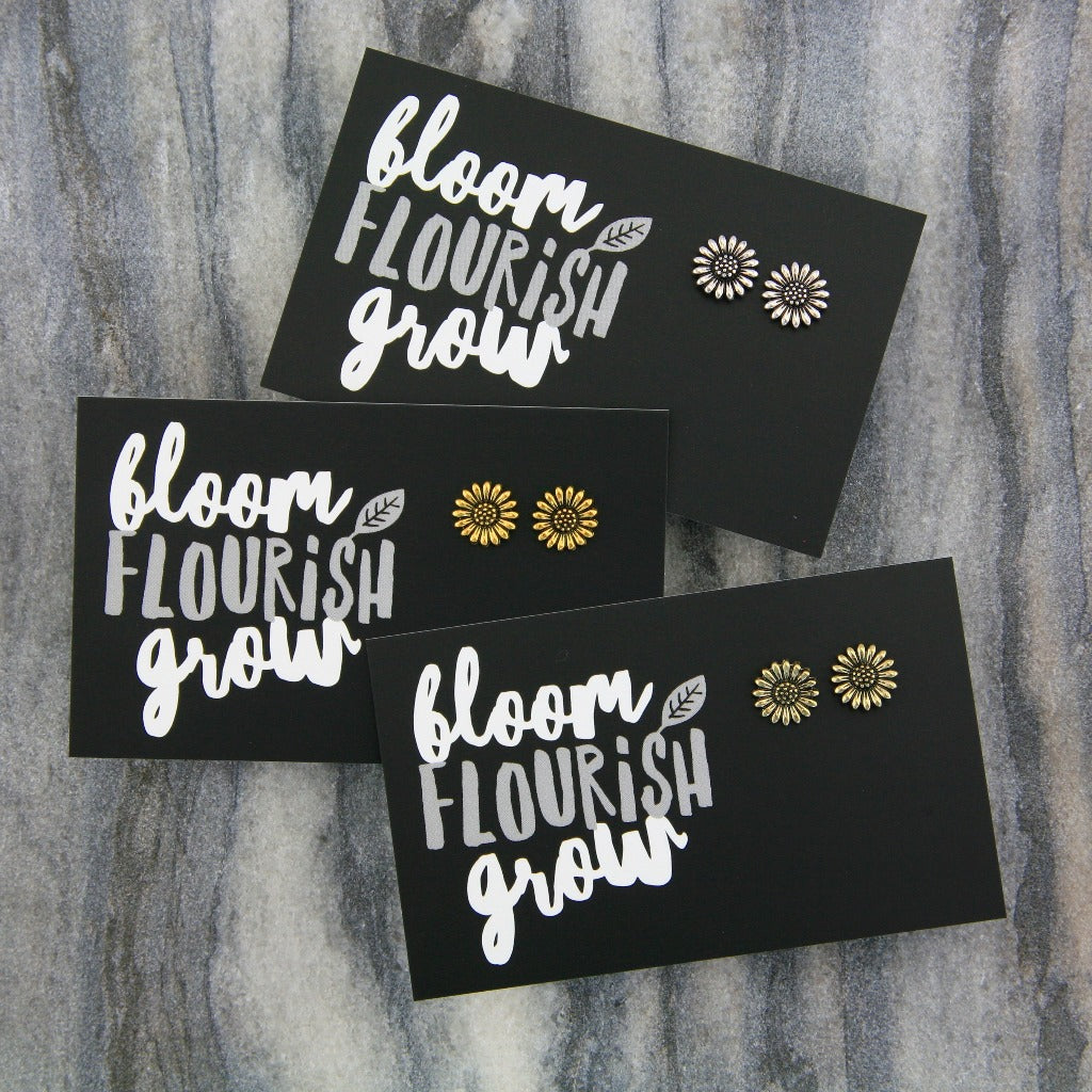 a set of different coloured sunflower earrings