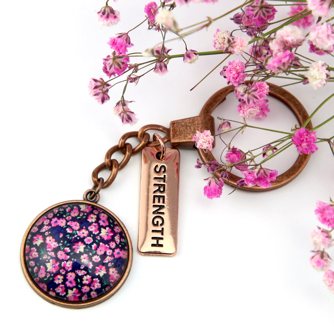 Pink floral print keyring with strength charm