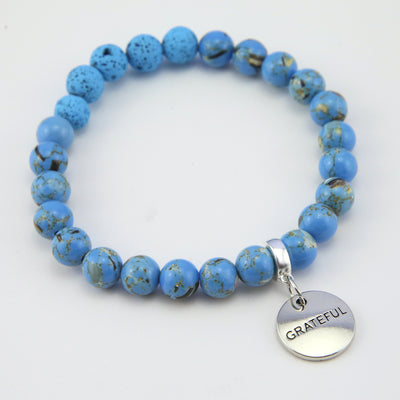 Lava Stone Bracelet -  8mm Blue Synthesis + Blue Lava Stone beads - with Silver Word Charm