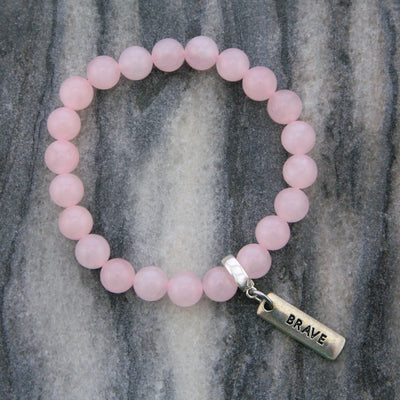 Rose Quartz 8mm stone bracelet with silver brave word charm and clip.