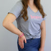 Grey Marle V-Neck Wo9men's T-shirt with pink brave screen print. Fundraiser for the national breast cancer foundation.