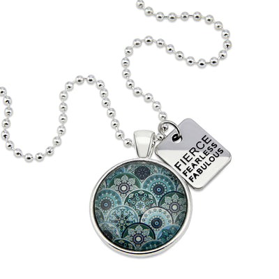 Teal print mandala pendant necklace in bright silver with fierce fearless fabulous charm.