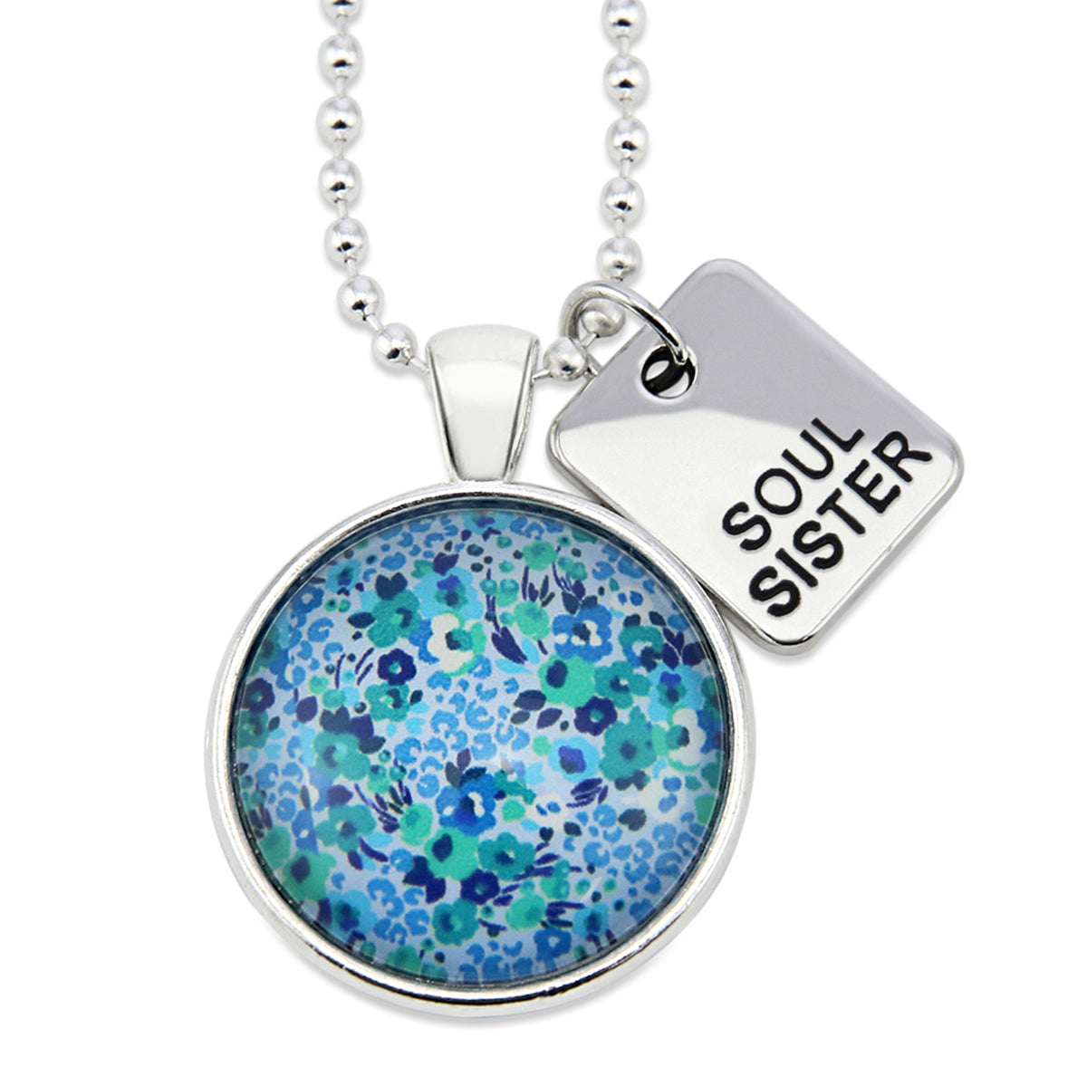 Teal floral print pendant necklace in bright silver with soul sister charm. 