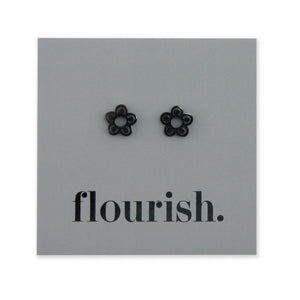Flower Power studs in black stainless steel on a foil flourish card.
