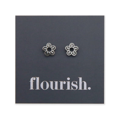 lower Power studs in silver stainless steel on a foil flourish card.