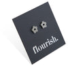 Flower Power studs in silver stainless steel on a foil flourish card.