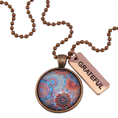 Blue, red, and orange patterned print vintage copper pendant necklace with vintage copper ball chain and Grateful word charm.