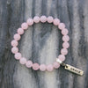Rose Quartz 8mm stone bracelet with silver grace word charm and clip.