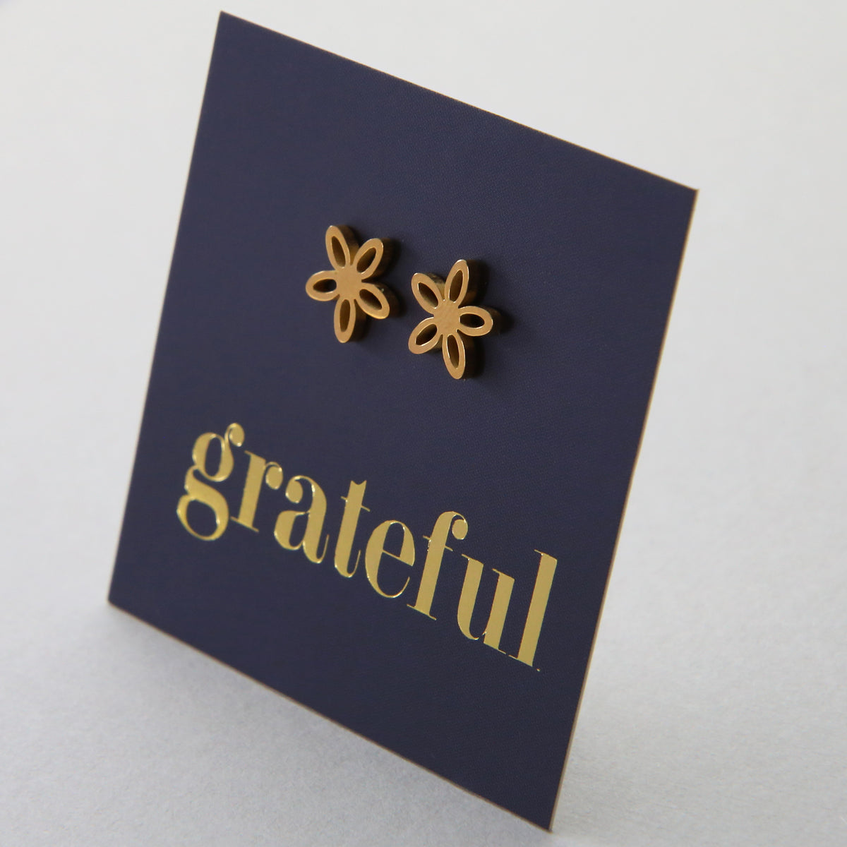 Stainless Steel Geo flower shape earrings. Hypoallergenic studs in Rose Gold, Silver, Black & Gold. Star shaped. Beautiful Gifts by Sister and Soul. Foil feature gift card Girl you are amazing.