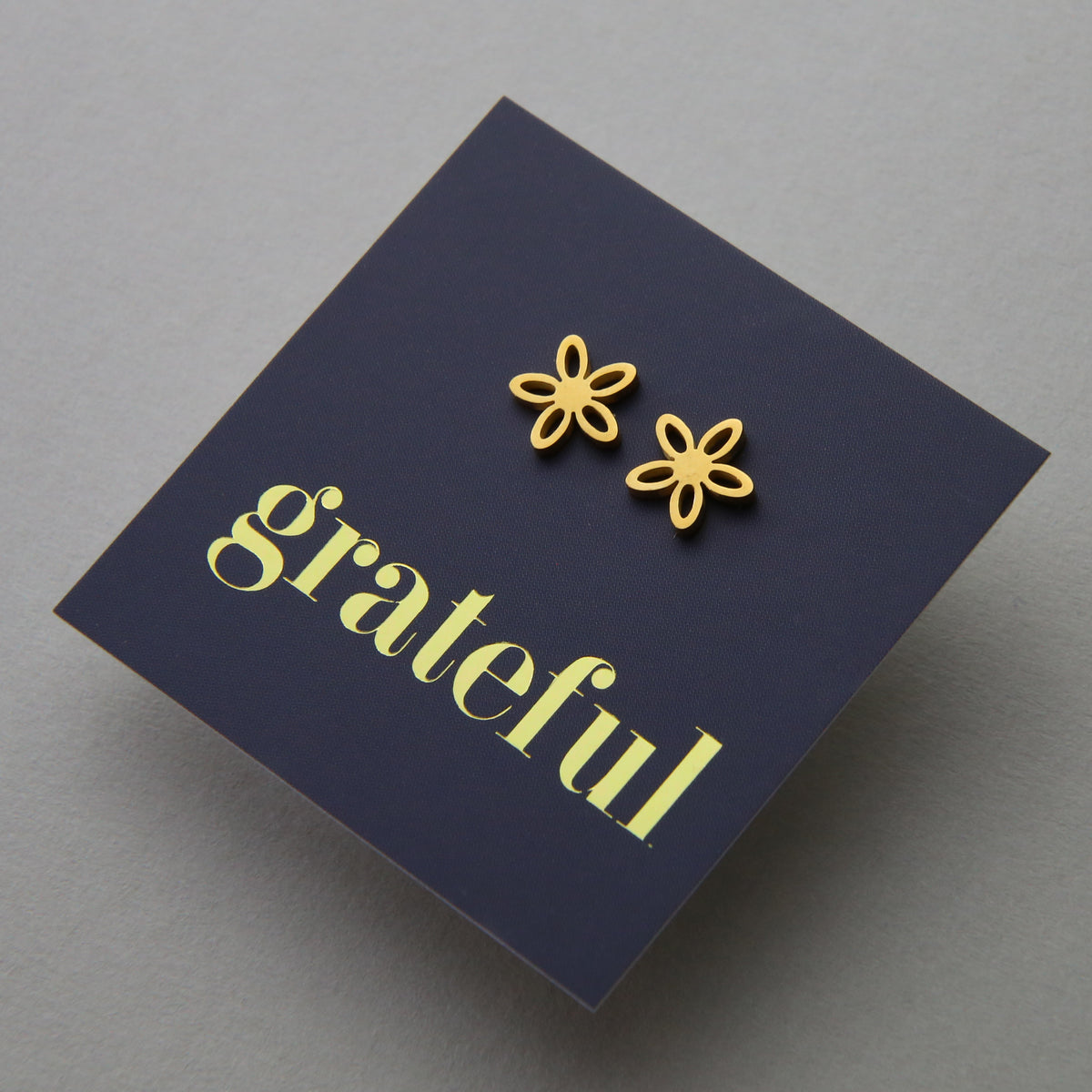 Stainless Steel Geo flower shape earrings. Hypoallergenic studs in Rose Gold, Silver, Black & Gold. Star shaped. Beautiful Gifts by Sister and Soul. Foil feature gift card Girl you are amazing.