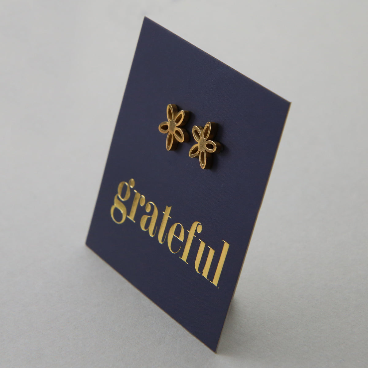 Stainless Steel Geo flower shape earrings. Hypoallergenic studs in Rose Gold, Silver, Black & Gold. Star shaped. Beautiful Gifts by Sister and Soul. Foil feature gift card Girl you are amazing.