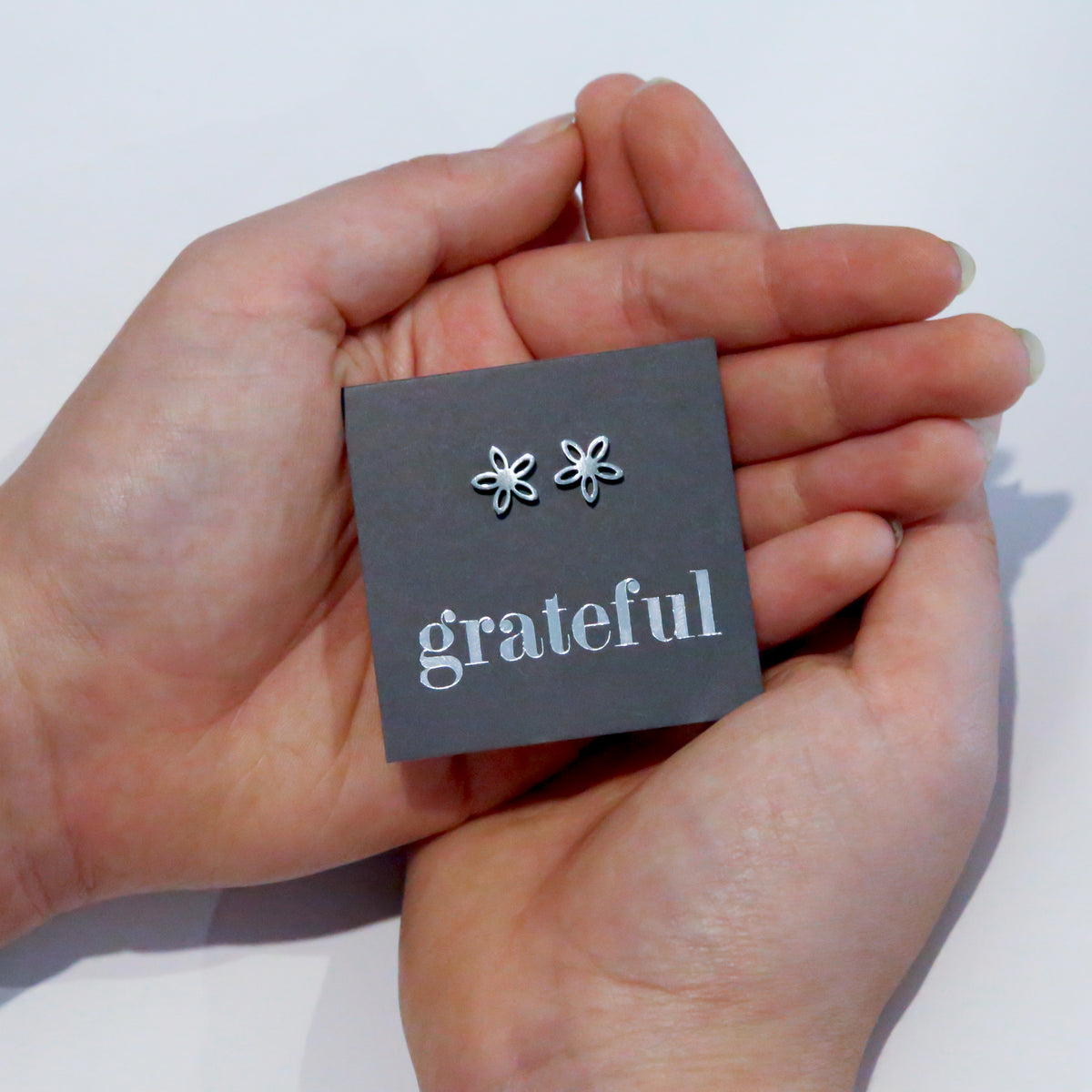 Stainless Steel Geo flower shape earrings. Hypoallergenic studs in Rose Gold, Silver, Black & Gold. Star shaped. Beautiful Gifts by Sister and Soul. Foil feature gift card Girl you are amazing.