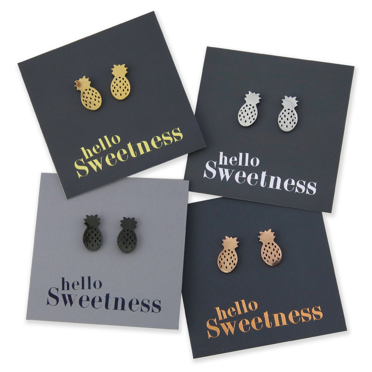 silver, rose gold, gold and black stainless steel pineapple earring studs on foil hello sweetness