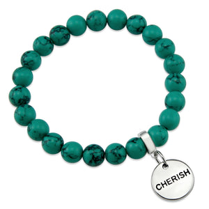 Teal coloured stone bead bracelet with silver meaningful word charm. 