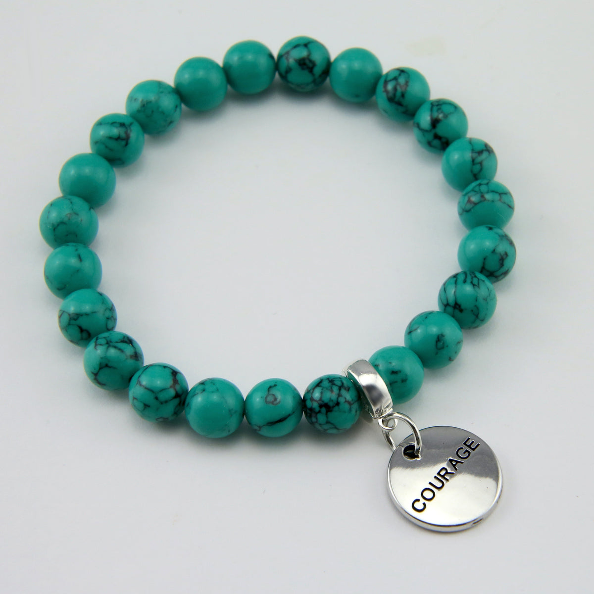 Teal coloured stone bead bracelet with silver meaningful word charm. 
