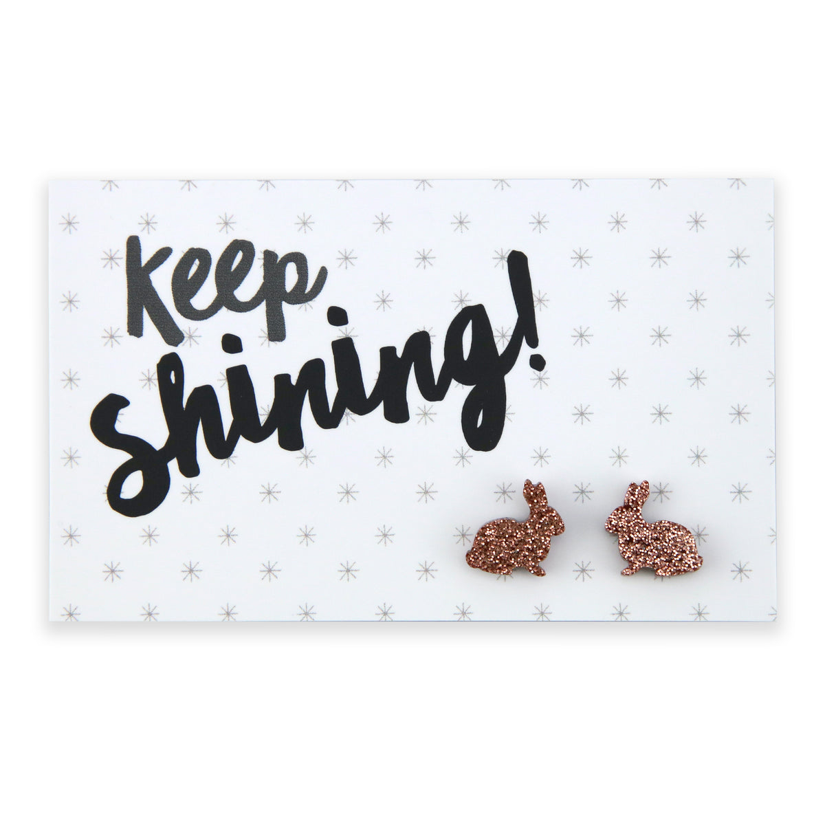 A pair of rose gold glitter acrylic bunny stud earrings on a white background with the text 'Keep Shining!' written in black.