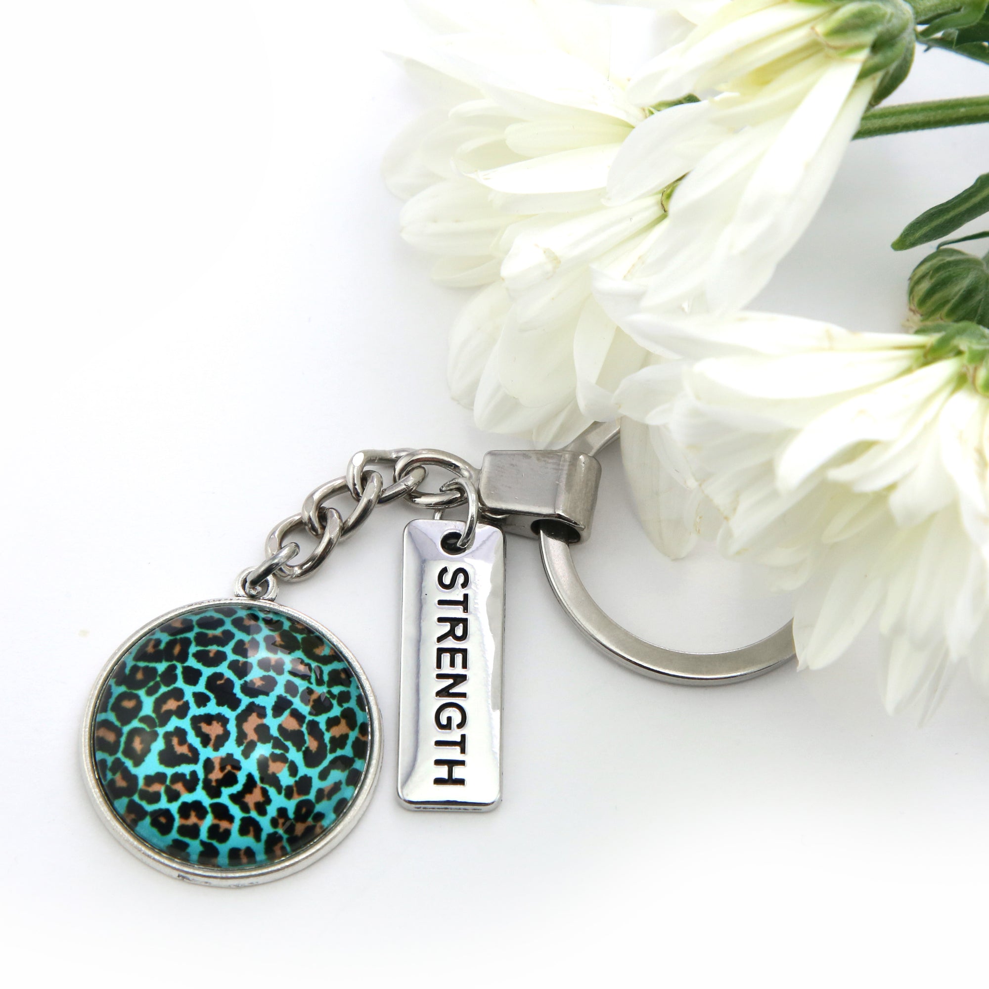 Teal print silver keying accessory with strength charm