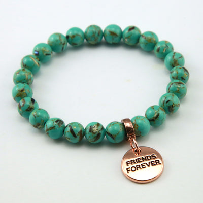 Light teal stone bead bracelet with rose gold meaningful word charm.