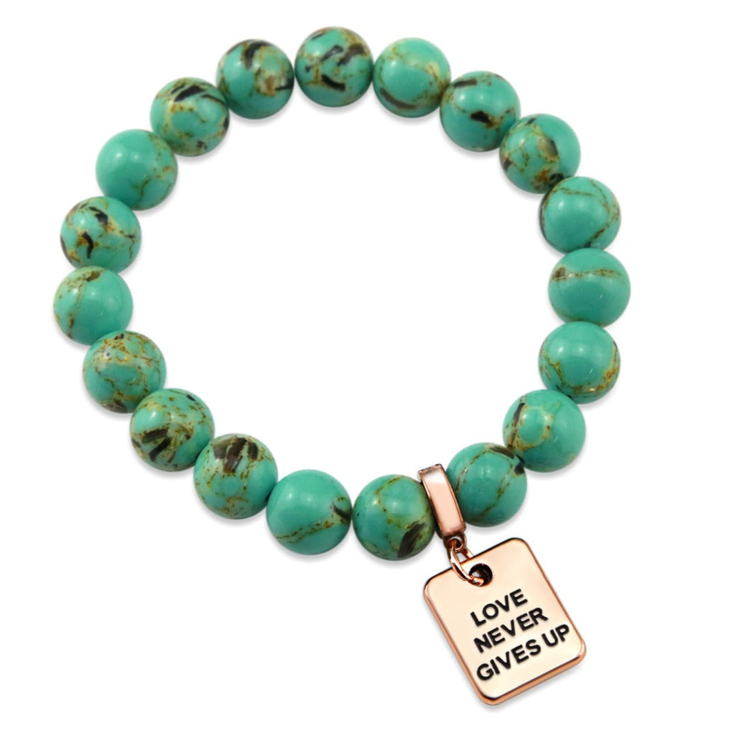 Teal coloured stone bead bracelet with rose gold word charm. 