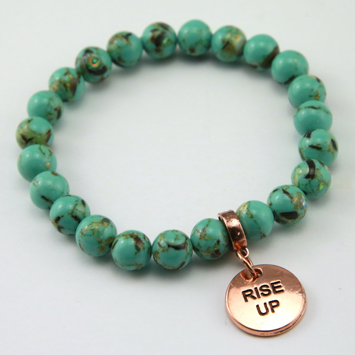 Light teal stone bead bracelet with rose gold meaningful word charm. 