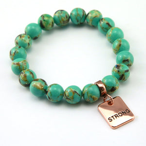 Teal coloured stone bead bracelet with rose gold word charm. 