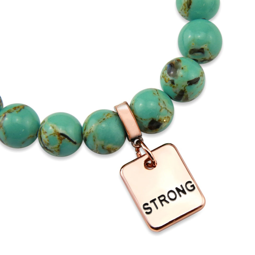 Teal coloured stone bead bracelet with rose gold word charm. 