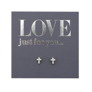 The image shows a pair of sterling silver stud earrings with a tiny cross design, presented on a card with the text 'LOVE JUST FOR YOU.