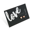 Cute heart shape earring studs in rose gold on love just for you card.