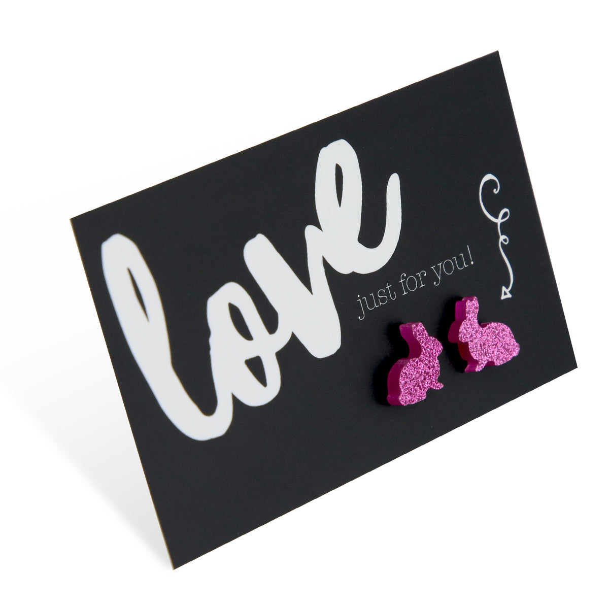 A pair of pink glitter acrylic bunny stud earrings on a black background with the words 'love just for you' written in white cursive.