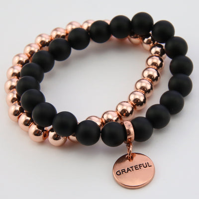 Stone Bead Bracelet Duo. Matt Black Onyx stone with rose gold clip and GRATEFUL word charm with rose gold hematite stacker bracelet.