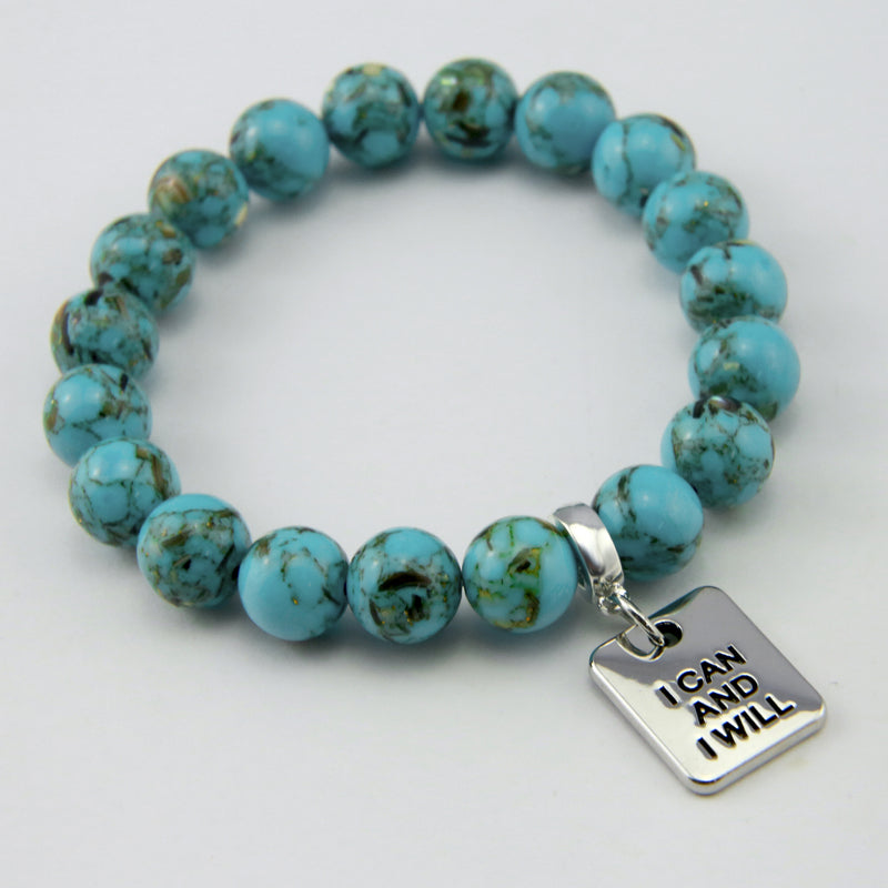 Teal coloured stone bracelet with word charm and silve r clip. 