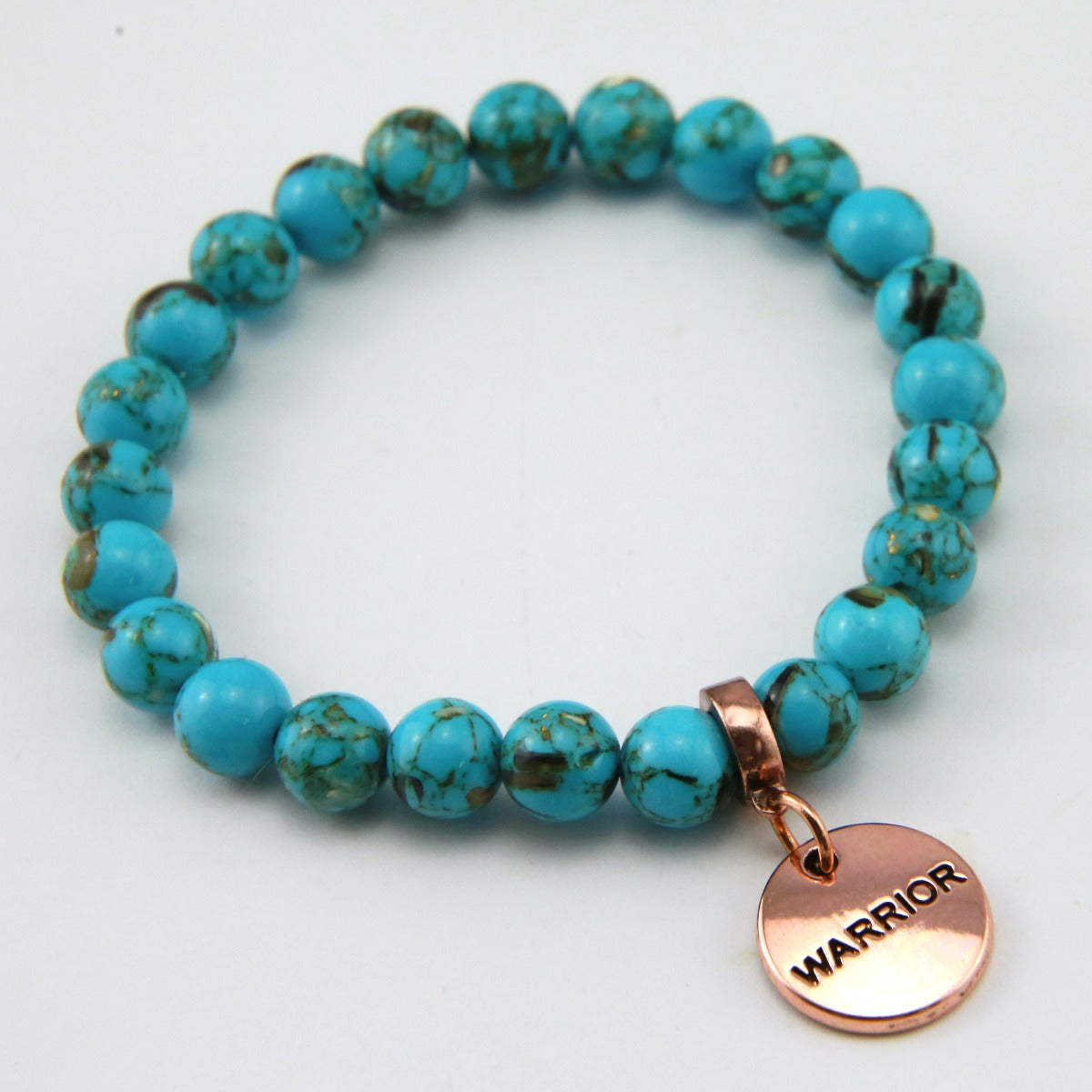 Teal coloured stone bracelet with word charm and rose gold clip. 