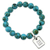 Teal coloured stone bracelet with word charm and silve r clip.